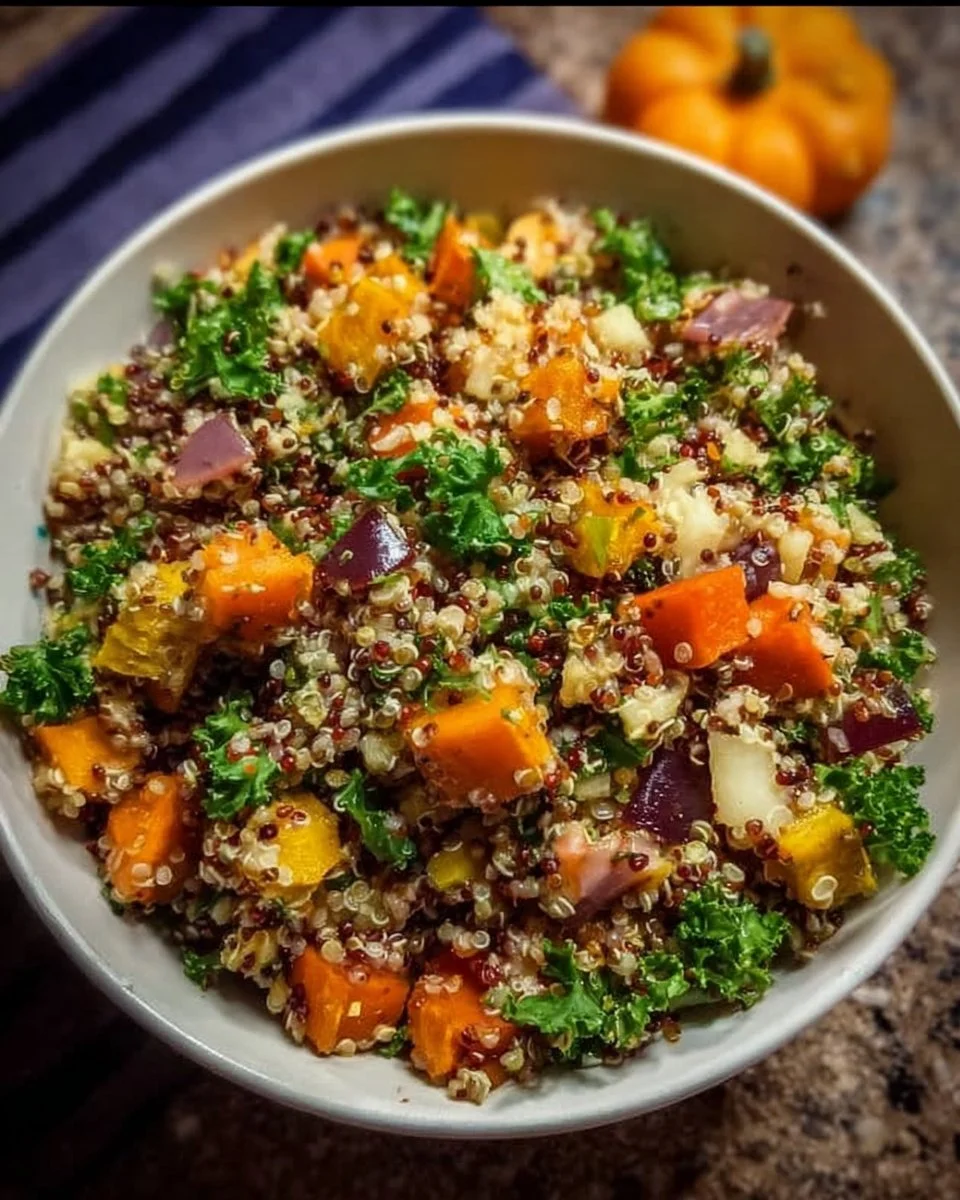 Bowls of colorful Fall Harvest Quinoa Salad with fresh vegetables and herbs
