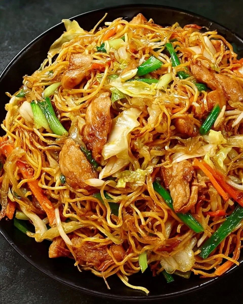 Delicious Chicken Chow Mein with flavorful Chow Mein sauce garnished with vegetables