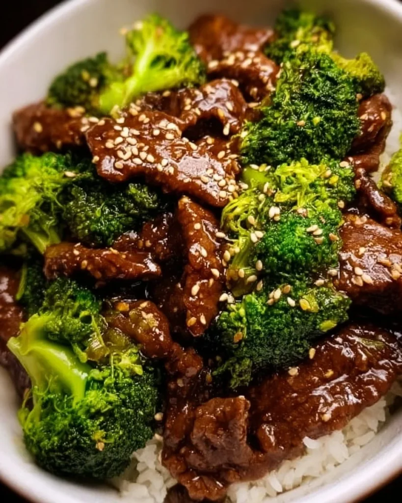 Crockpot Beef and Broccoli served with rice on a plate
