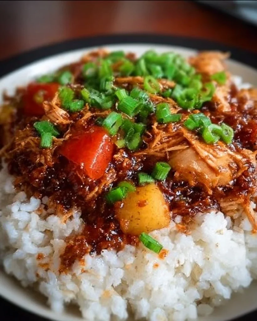 Healthy Hawaiian Crockpot Chicken served in a bowl with tropical ingredients