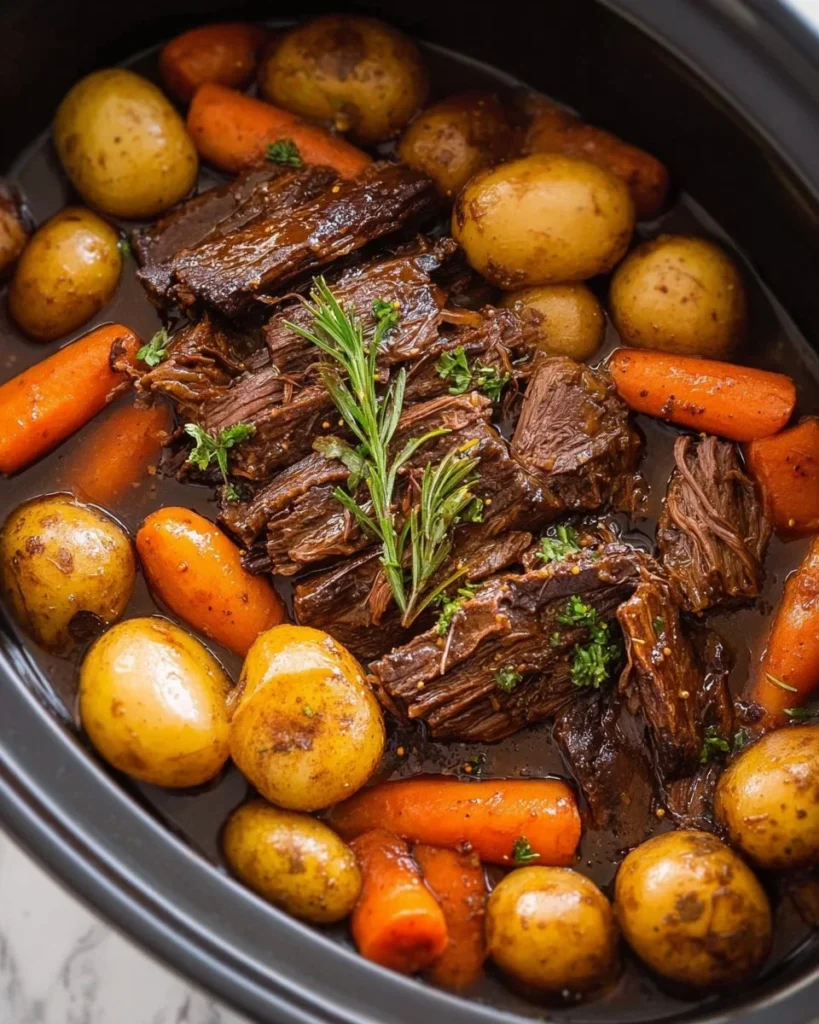 Delicious slow cooker pot roast with vegetables in a serving dish