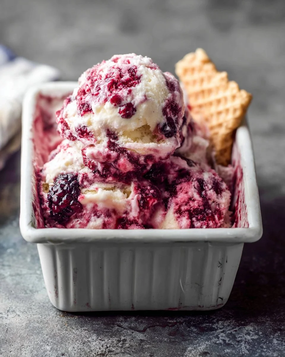 Southern Blackberry Cobbler Ice Cream topped with fresh blackberries