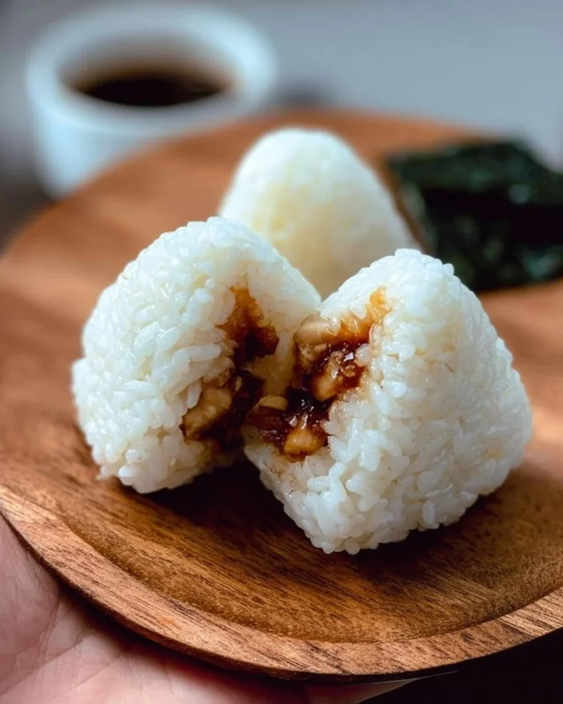 Delicious Chicken Rice Ball served with fresh herbs and sauce