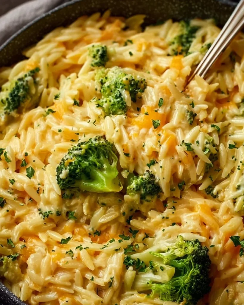 Creamy one-pot broccoli cheddar orzo with fresh broccoli and melted cheese.