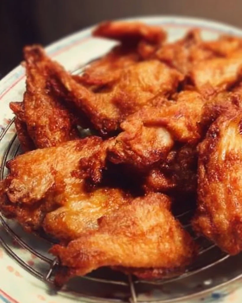 Delicious fried chicken wings served in Chinese restaurant style.