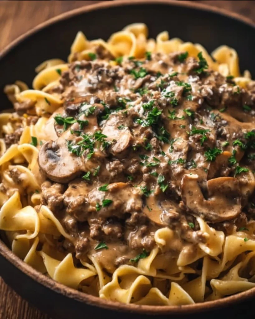 Plate of delicious ground beef stroganoff served with egg noodles.
