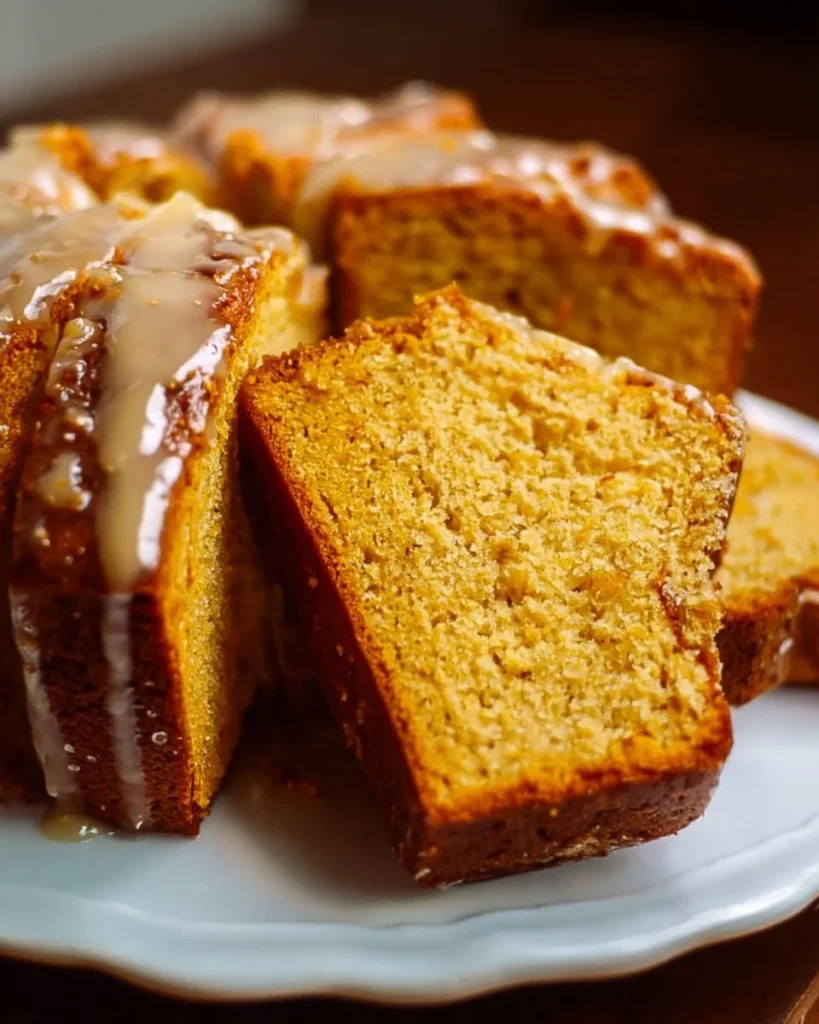 Delicious slice of sweet potato pound cake with creamy frosting