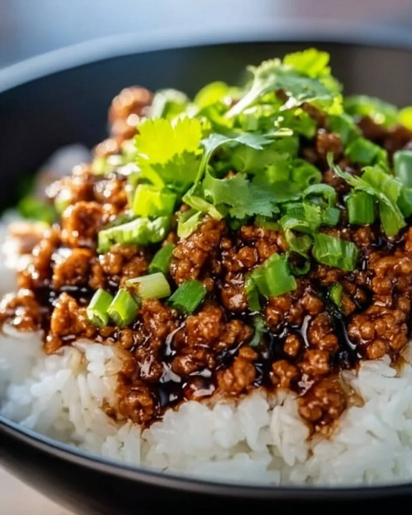 Honey Garlic Ground Turkey dish served in a bowl with garnishes.