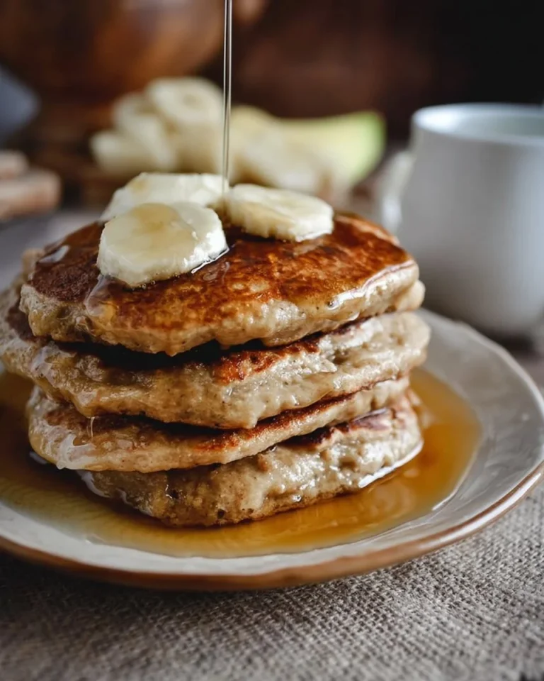 Whole wheat brown sugar banana bread pancakes stacked on a plate