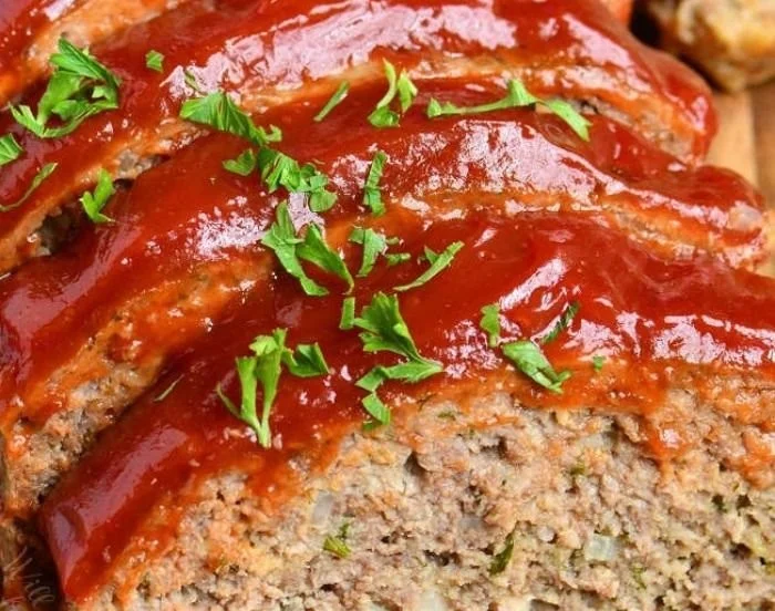 Delicious classic meatloaf served with mashed potatoes and green beans