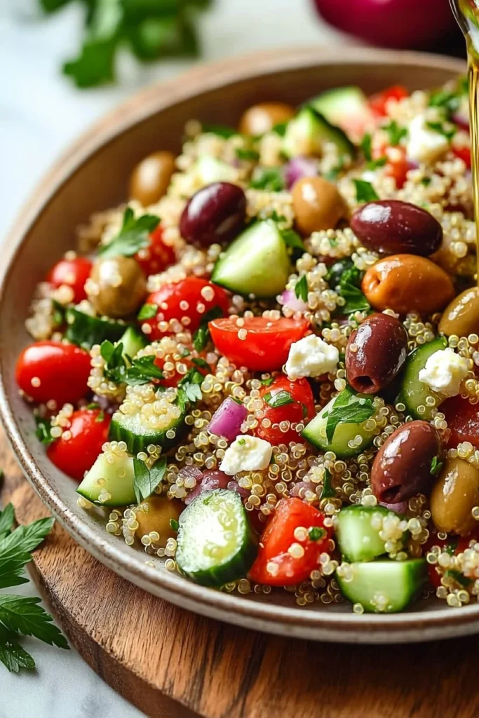 Bowl of Mediterranean Quinoa Salad with fresh vegetables and herbs