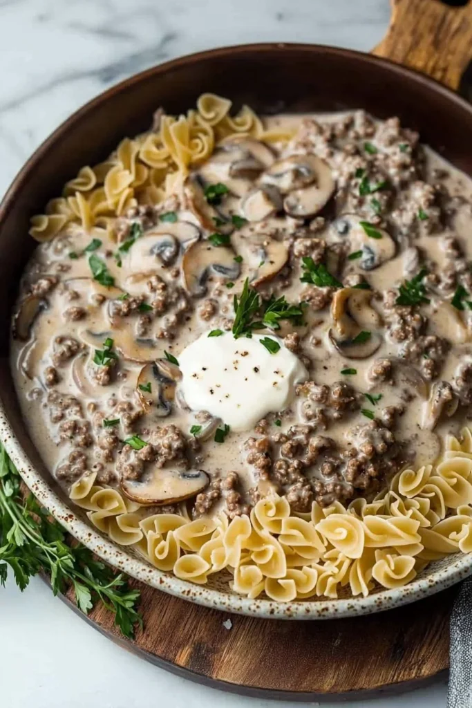 Creamy ground beef and mushroom dish served in a skillet