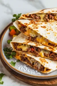 Easy cheese beef quesadilla with melted cheese and seasoned beef filling