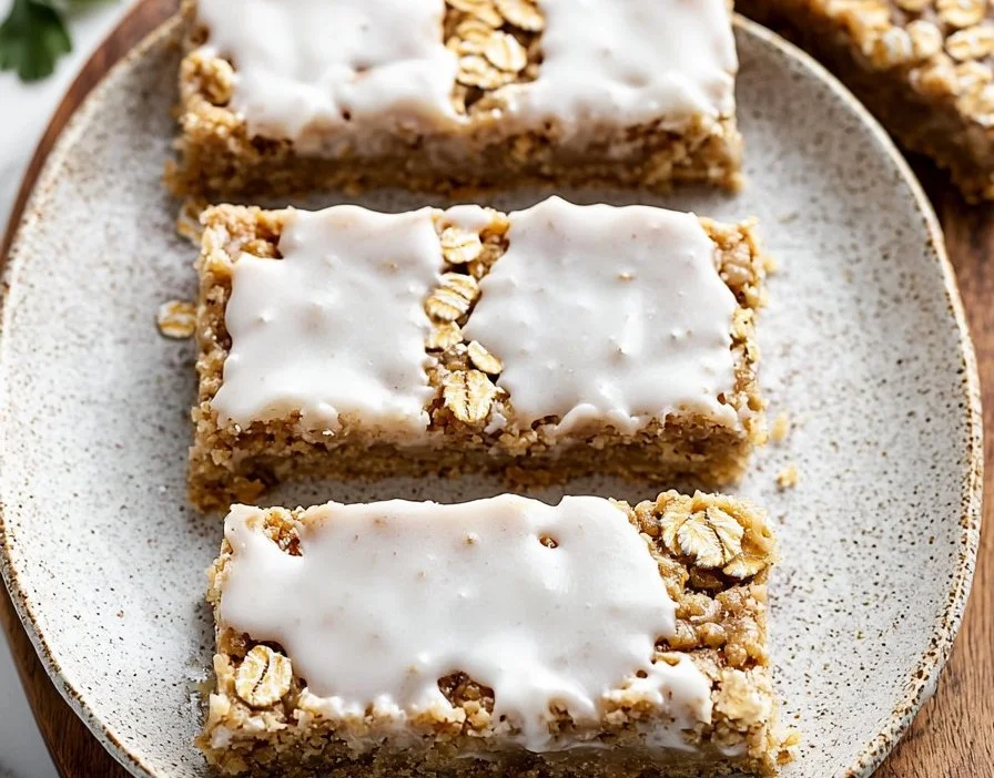 Delicious iced oatmeal cookie bars topped with creamy icing