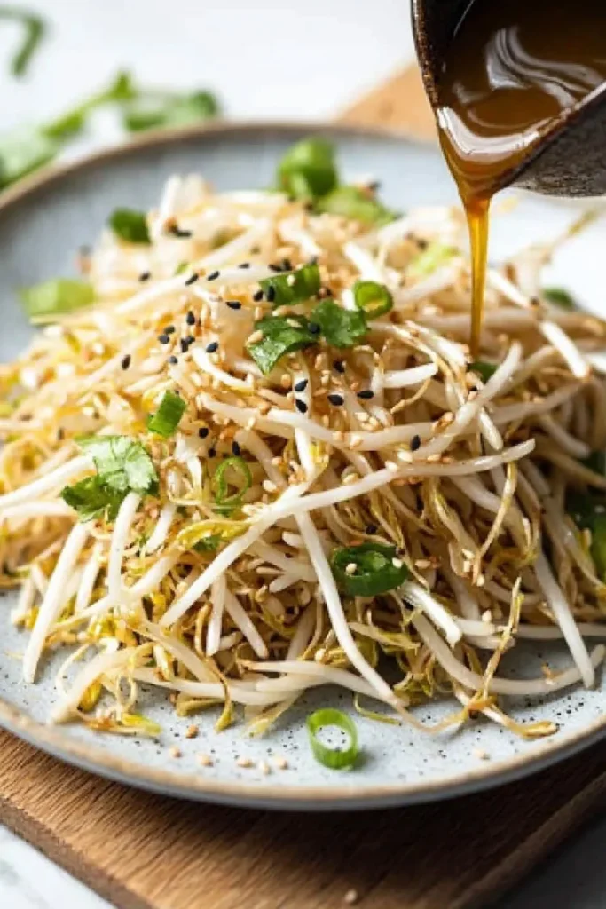 Korean bean sprout salad with colorful vegetables in a bowl
