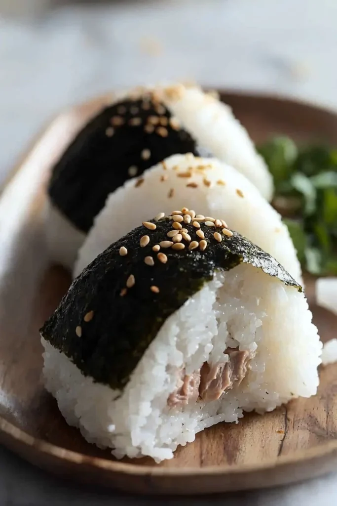 Delicious Japanese tuna rice balls served on a wooden plate