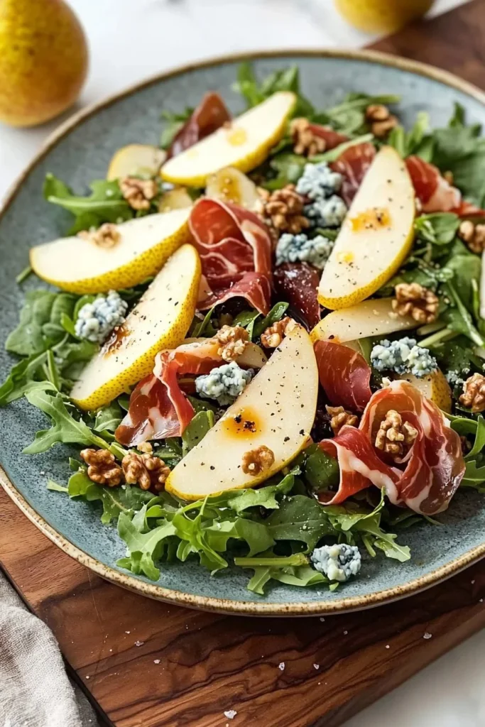 Delicious Pear and Prosciutto Salad with greens and nuts